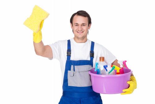 Technician wearing PPE while preparing carpet cleaning equipment